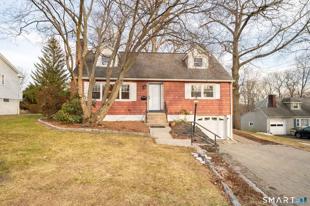 a view of a house with snow on the background
