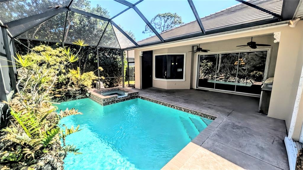 124 Turquoise Lane Osprey, FL 34229 - Photo 21 of 48 a view of a backyard with garden and patio