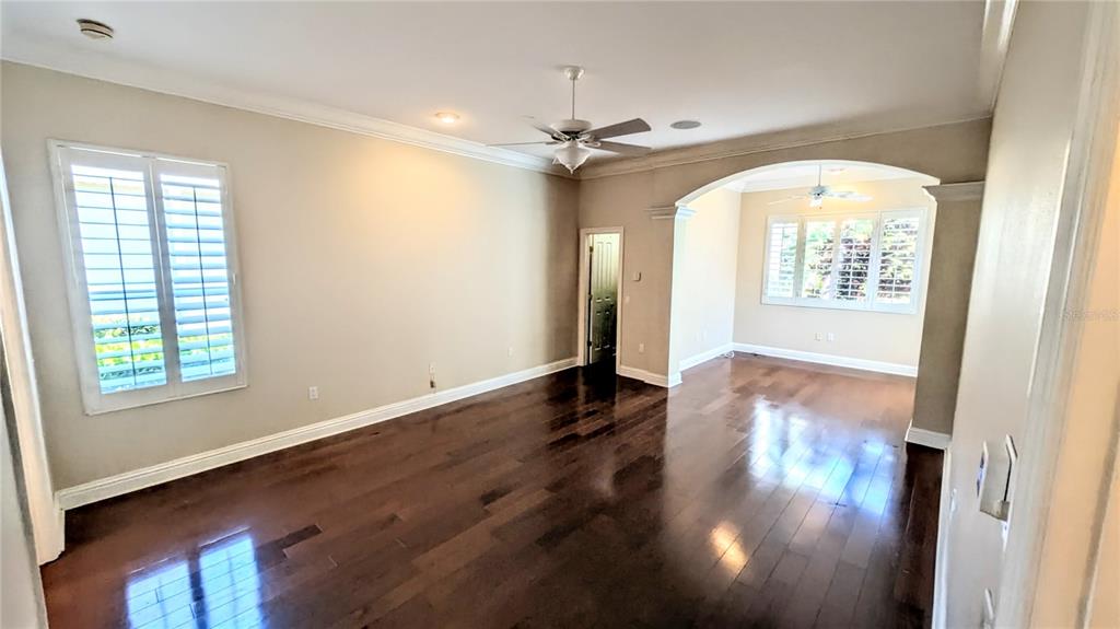 124 Turquoise Lane Osprey, FL 34229 - Photo 25 of 48 wooden floor in an empty room with a window