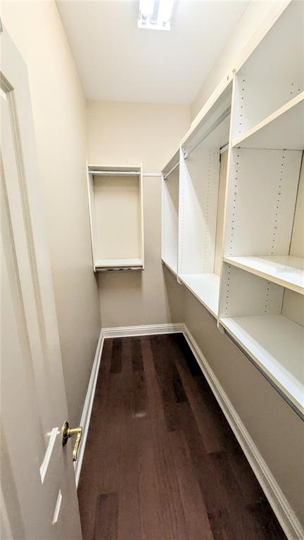 124 Turquoise Lane Osprey, FL 34229 - Photo 27 of 48 a view of an empty room with wooden floor and a window