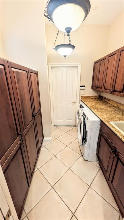 124 Turquoise Lane Osprey, FL 34229 - Photo 44 of 48 a utility room with dryer and washer