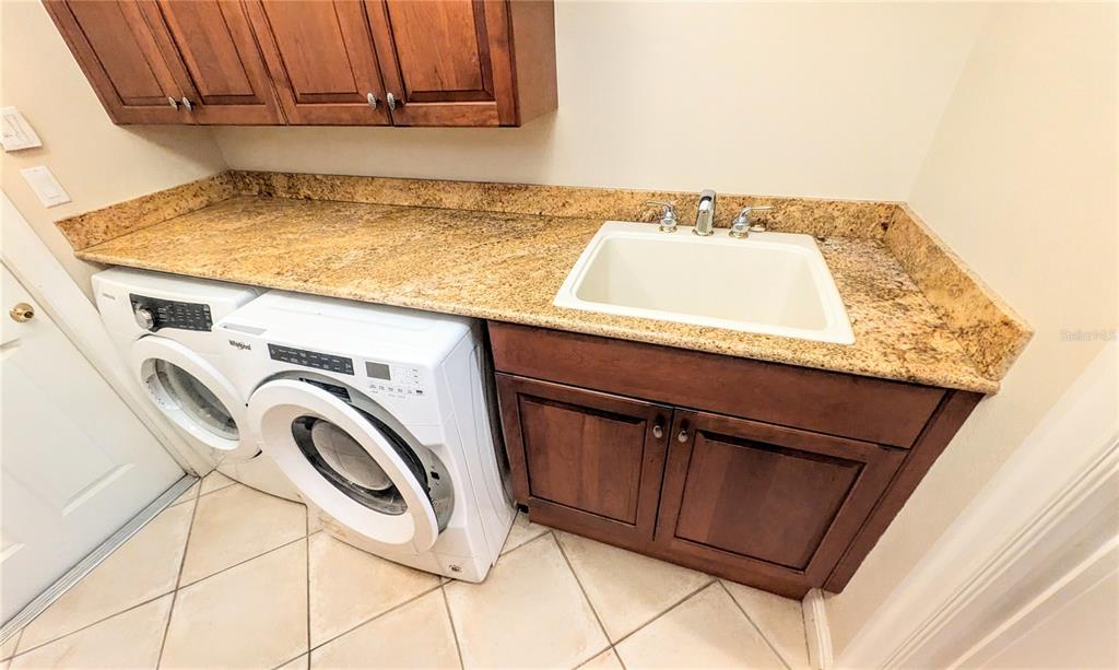 124 Turquoise Lane Osprey, FL 34229 - Photo 45 of 48 a utility room with dryer and washer