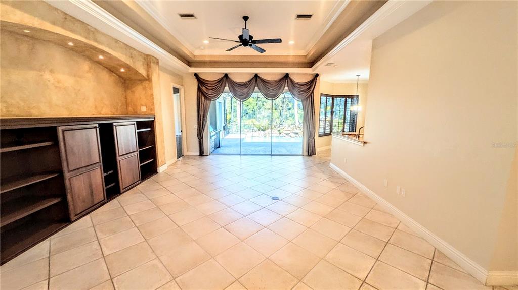 124 Turquoise Lane Osprey, FL 34229 - Photo 6 of 48 a view of a room with wooden floor and windows