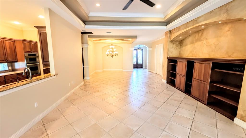 124 Turquoise Lane Osprey, FL 34229 - Photo 8 of 48 a hallway with wooden floor and furniture
