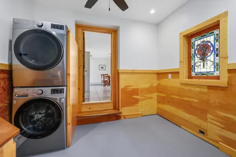a view of a bedroom with washing machine and dryer