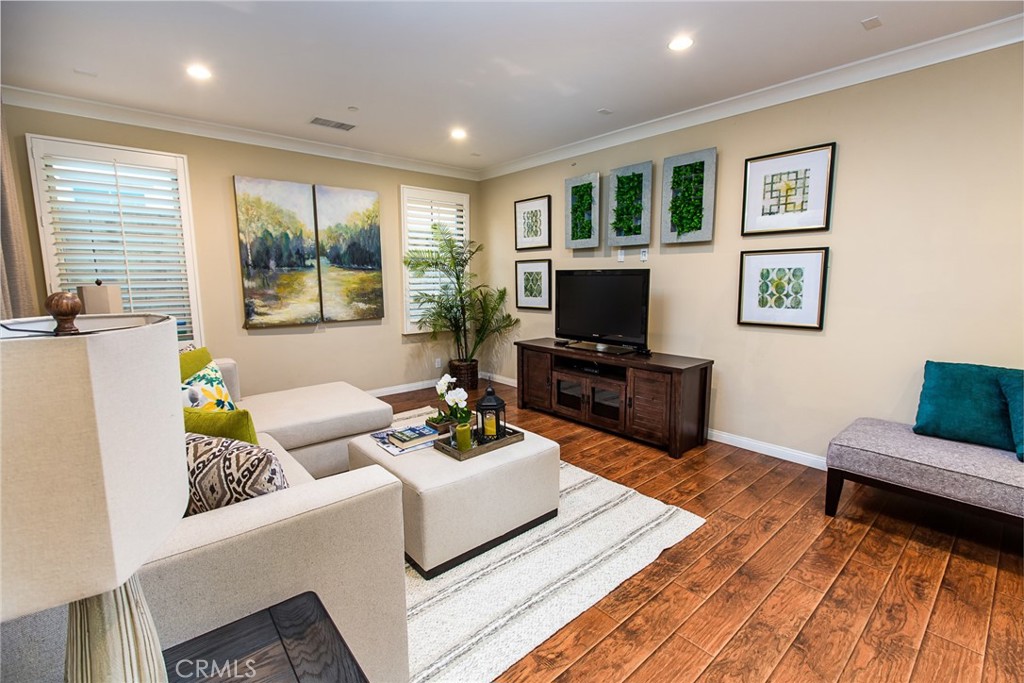 75 Gardenstone Path Irvine, CA 92620 - Photo 5 of 65 a living room with furniture and a flat screen tv