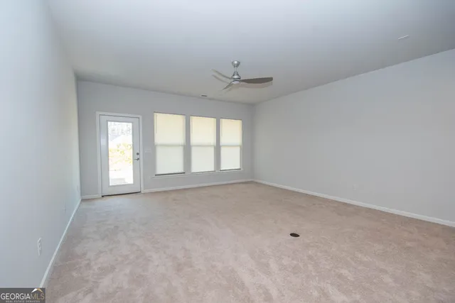 a view of a kitchen with a sink and a microwave
