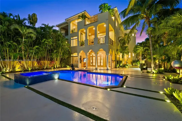 a view of swimming pool with red chairs