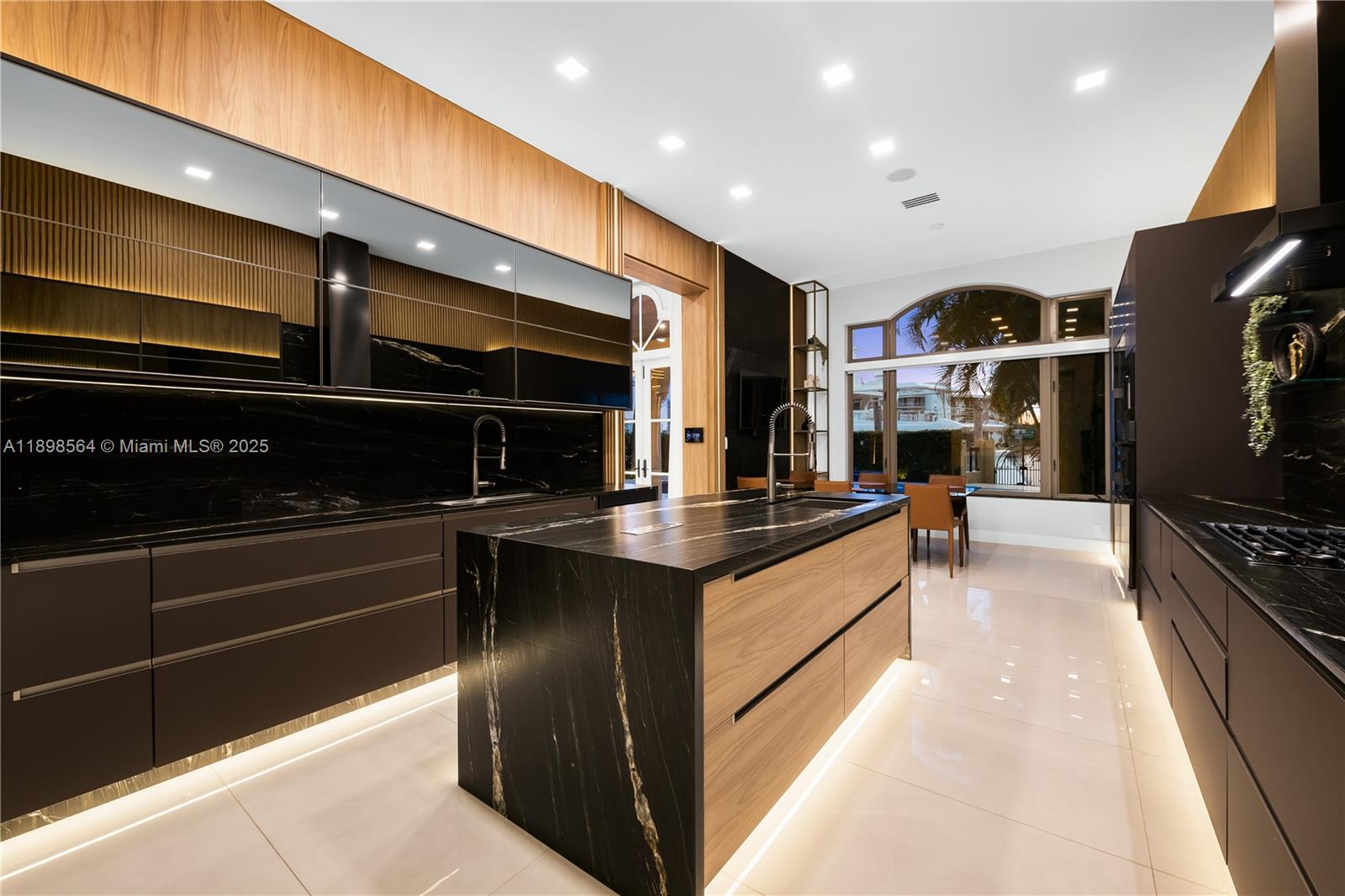 1530 Island Boulevard Aventura, FL 33160 - Photo 15 of 99 a large kitchen with stainless steel appliances and a large counter top