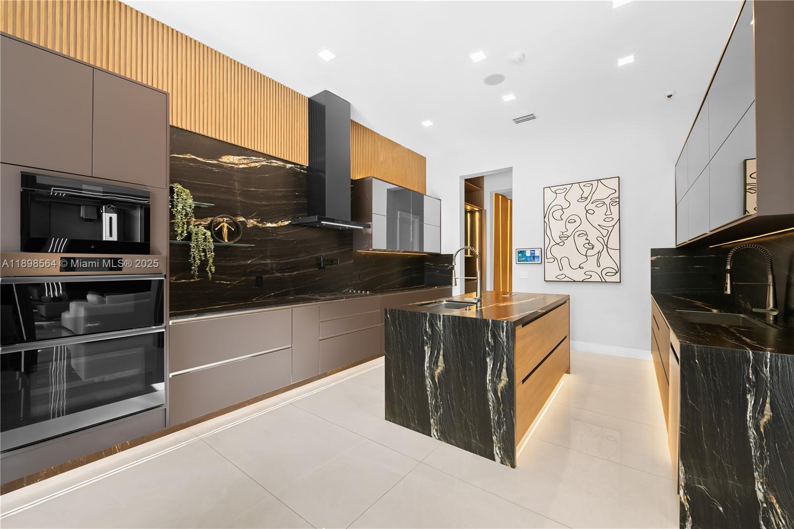 1530 Island Boulevard Aventura, FL 33160 - Photo 16 of 99 a kitchen with stainless steel appliances granite countertop a refrigerator and a stove top oven