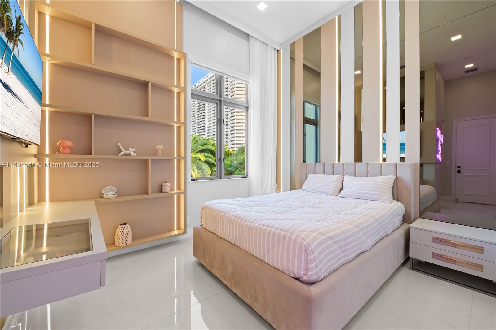 1530 Island Boulevard Aventura, FL 33160 - Photo 47 of 99 a bedroom with a large bed and a window