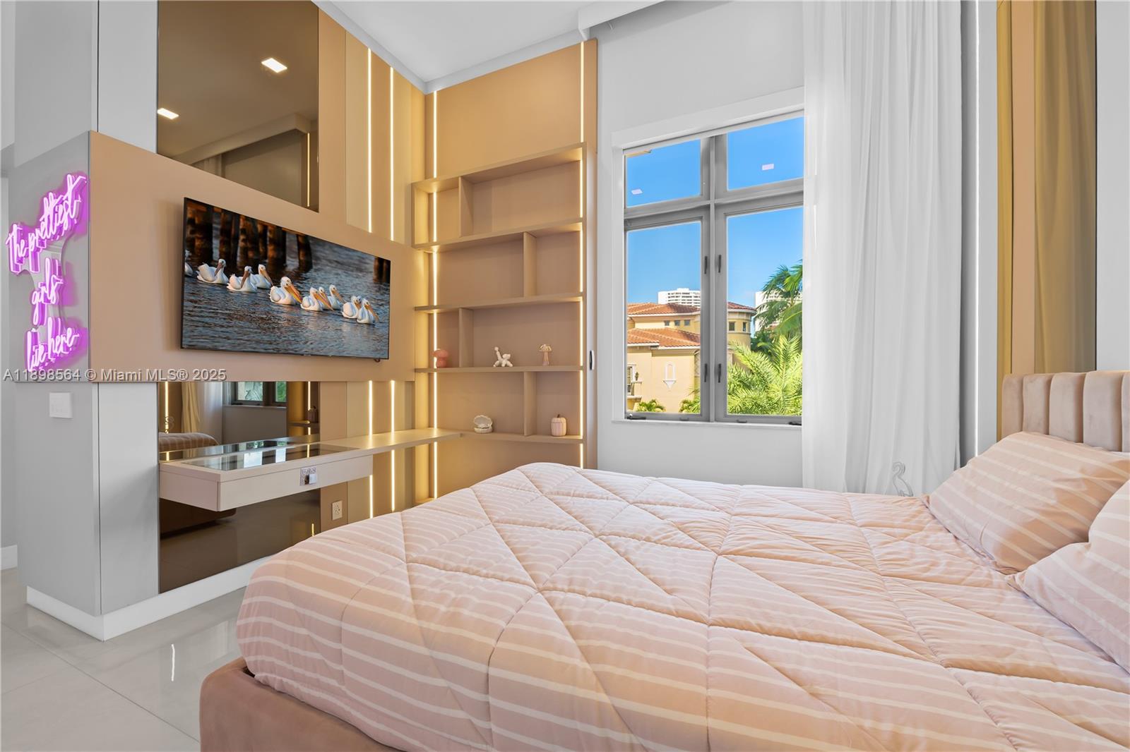 1530 Island Boulevard Aventura, FL 33160 - Photo 48 of 99 a bedroom with a bed and glass window