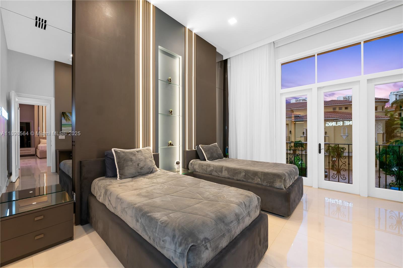 1530 Island Boulevard Aventura, FL 33160 - Photo 50 of 99 a bedroom with bed and large window