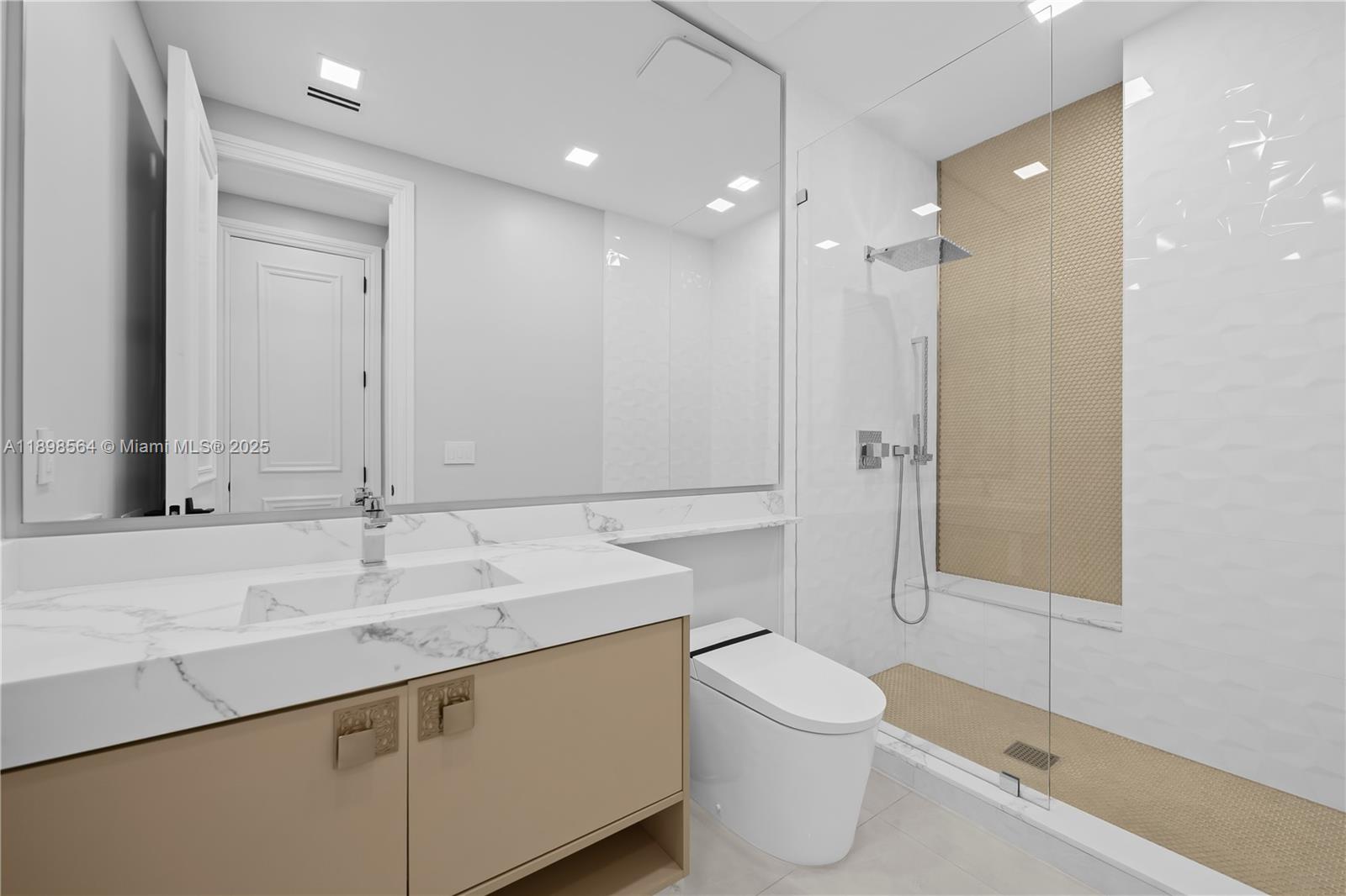 1530 Island Boulevard Aventura, FL 33160 - Photo 54 of 99 a bathroom with a sink a toilet and shower