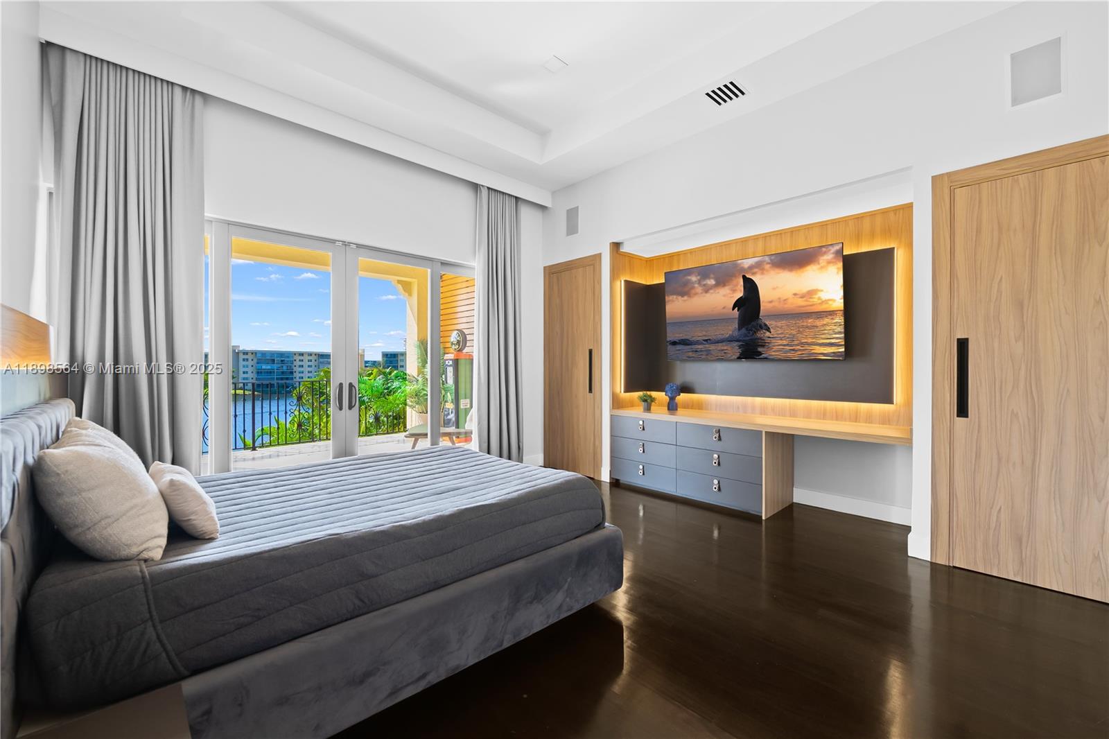 1530 Island Boulevard Aventura, FL 33160 - Photo 59 of 99 a bedroom with a bed and large window