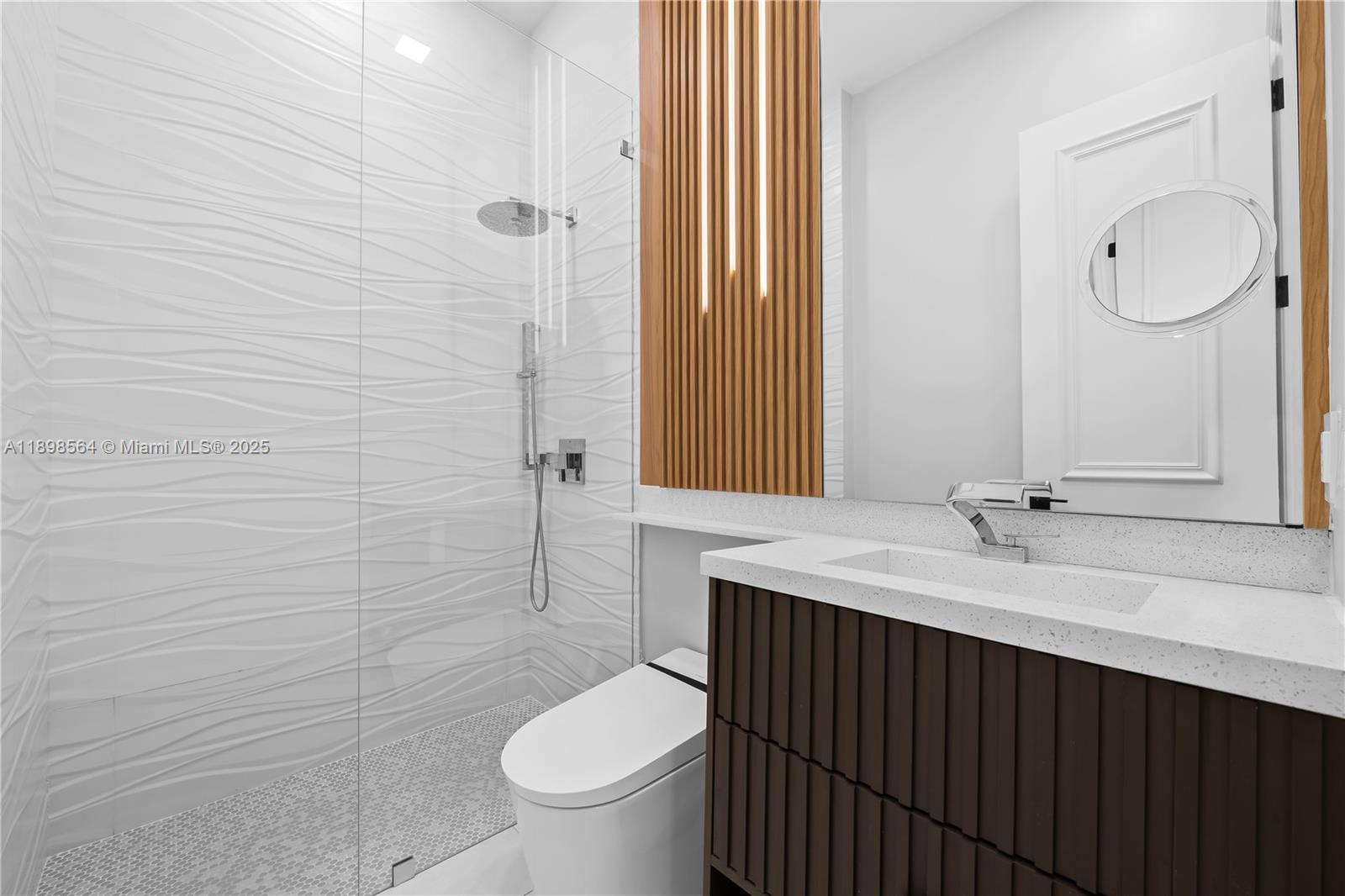 1530 Island Boulevard Aventura, FL 33160 - Photo 60 of 99 a bathroom with a granite countertop toilet sink and mirror