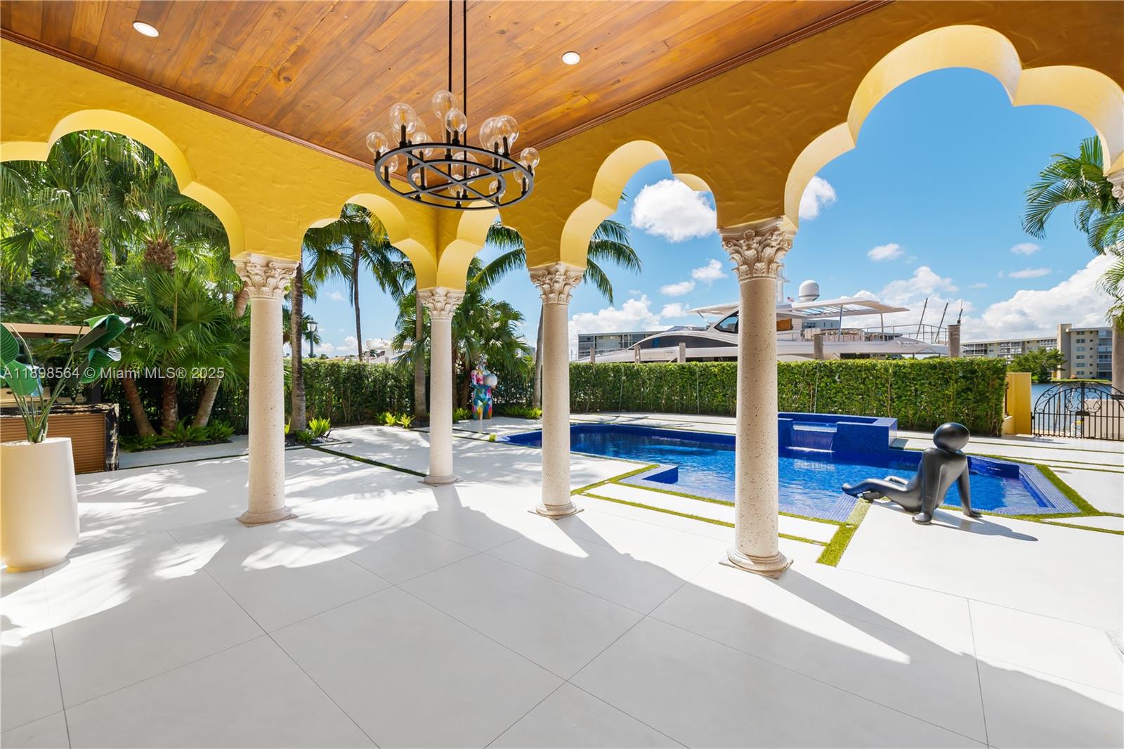 1530 Island Boulevard Aventura, FL 33160 - Photo 74 of 99 a view of swimming pool with a table and chairs next to yard