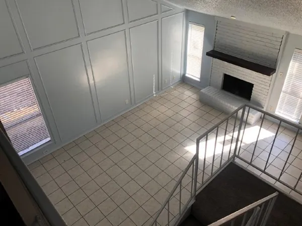 a view of an empty room and window