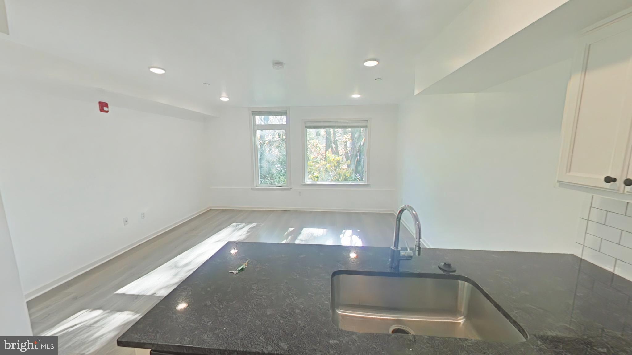 4539 Mitchell Street, Unit 202 Philadelphia, PA 19128 - Photo 3 of 7 a view of a room with a window