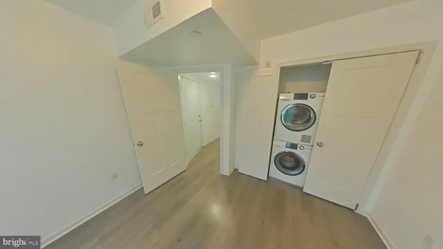 a view of storage and utility room with washer and dryer