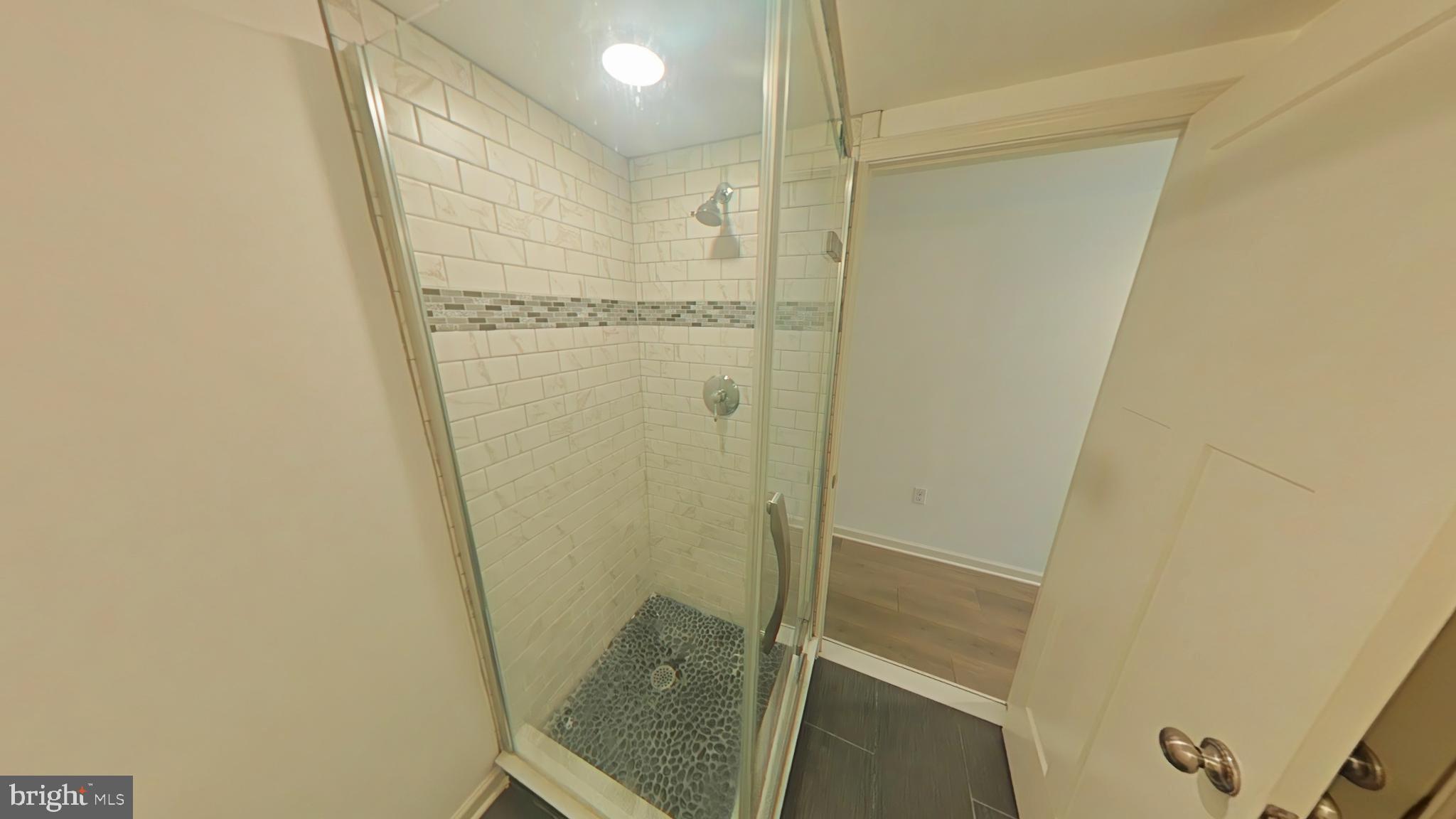 4539 Mitchell Street, Unit 202 Philadelphia, PA 19128 - Photo 6 of 7 a bathroom with a shower