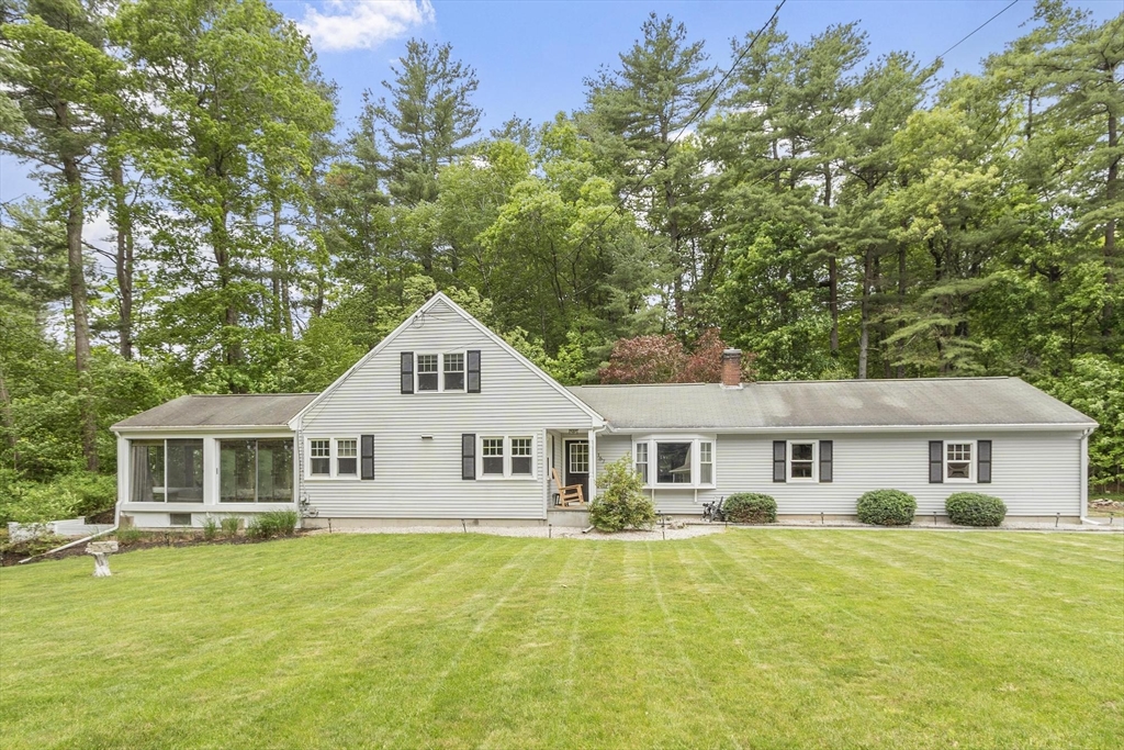 167 Gates Pond Road Berlin, MA 01503 - Photo 1 of 32 a front view of a house with a yard