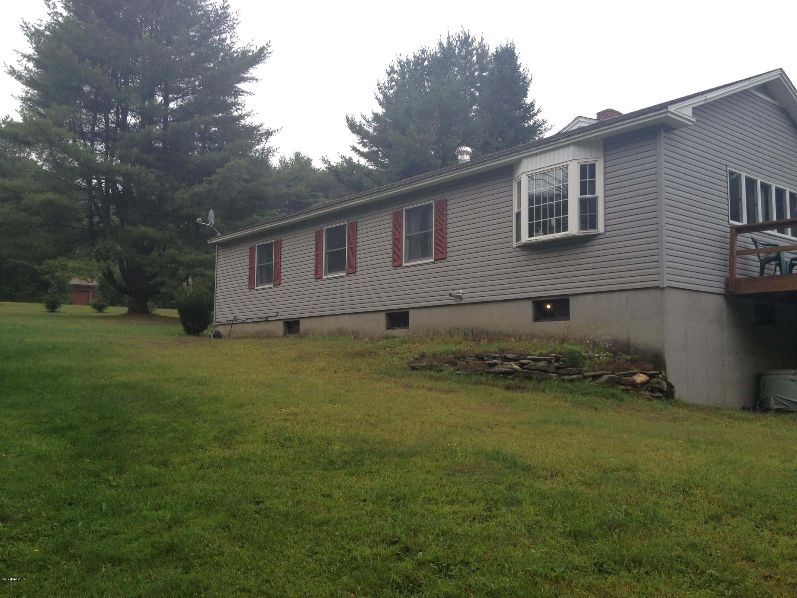 1273 South Washington State Road Washington, MA 01223 - Photo 3 of 22 a front view of a house with garden