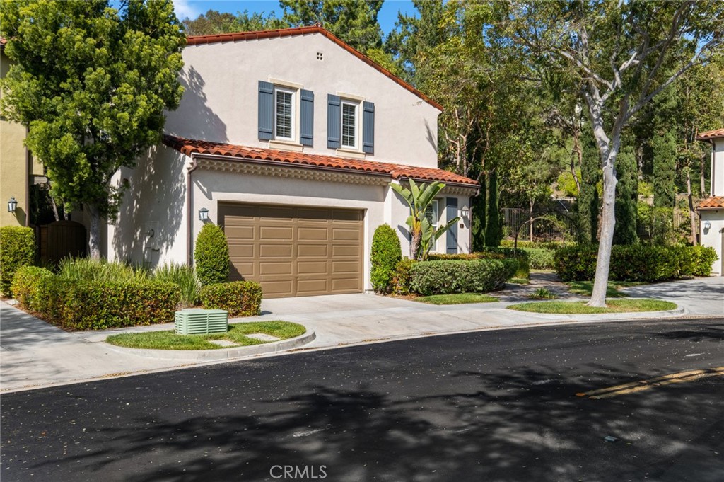 61 Bellwind Irvine, CA 92603 - Photo 22 of 22 a front view of a house with a yard and garage
