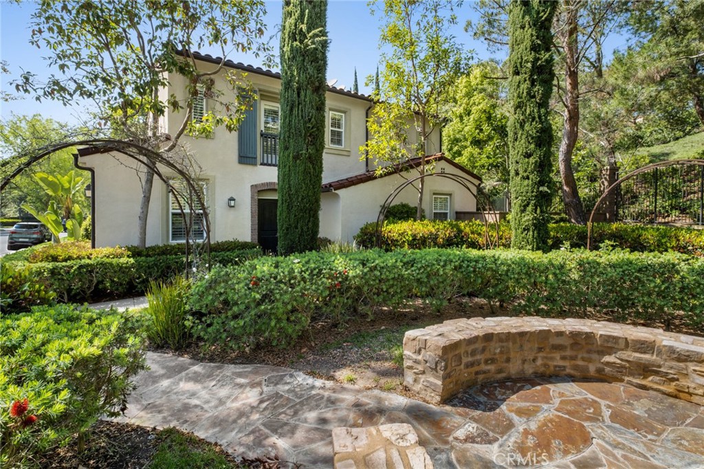 61 Bellwind Irvine, CA 92603 - Photo 3 of 22 a view of a garden with a pathway