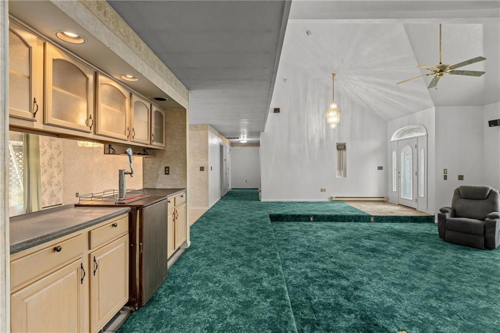 9260 Lakeview Drive Irwin, PA 15642 - Photo 11 of 47 a kitchen with stainless steel appliances kitchen island granite countertop a refrigerator and a sink