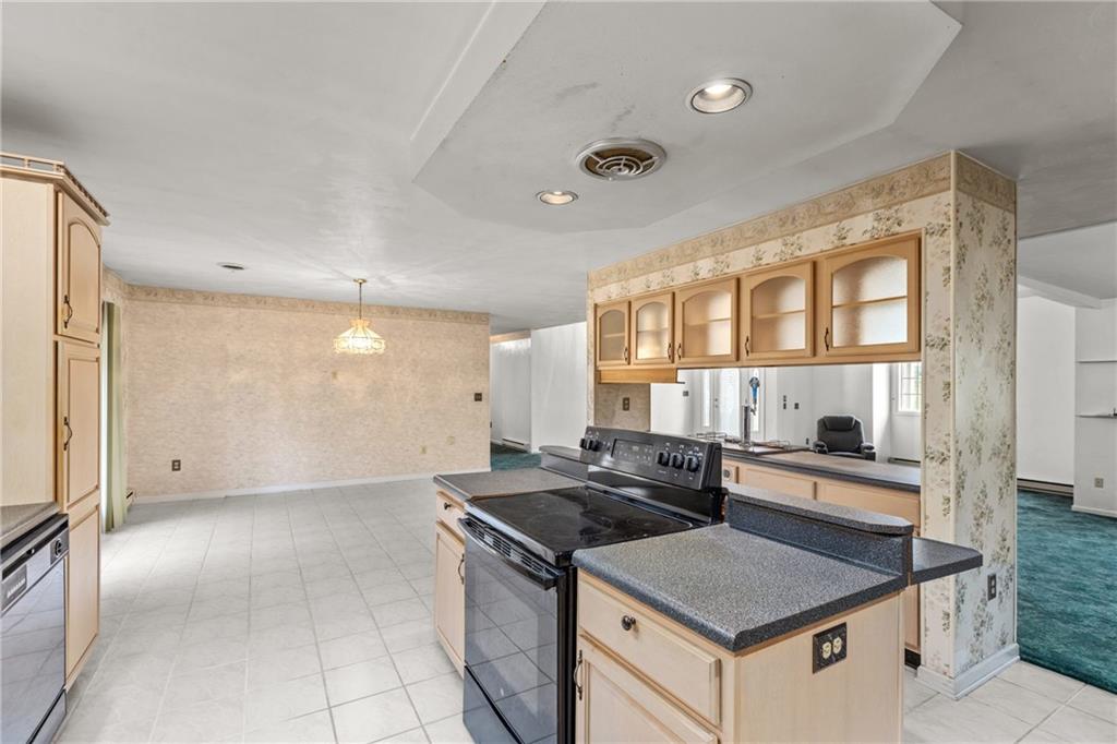 9260 Lakeview Drive Irwin, PA 15642 - Photo 12 of 47 a kitchen that has a sink and a stove