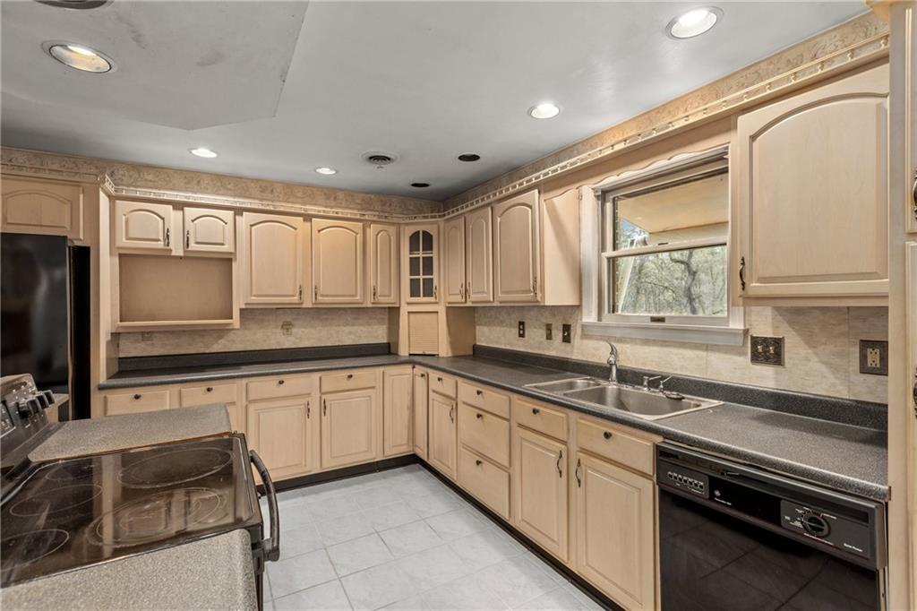 9260 Lakeview Drive Irwin, PA 15642 - Photo 13 of 47 a kitchen with stainless steel appliances granite countertop a sink and cabinets