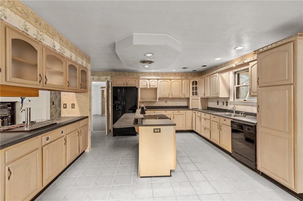 9260 Lakeview Drive Irwin, PA 15642 - Photo 15 of 47 a kitchen with stainless steel appliances granite countertop a stove top oven a sink a refrigerator and white cabinets