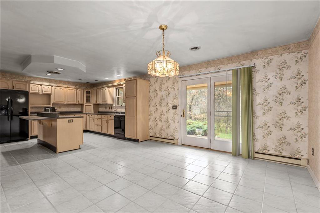 9260 Lakeview Drive Irwin, PA 15642 - Photo 17 of 47 a view of a kitchen with granite countertop stainless steel appliances and a chandelier