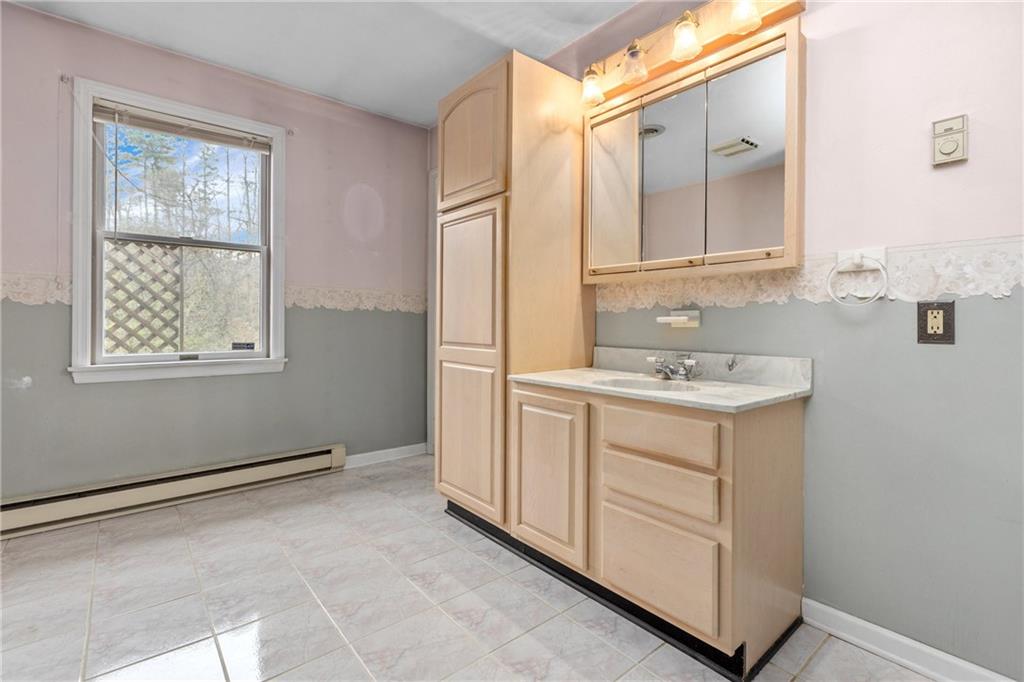 9260 Lakeview Drive Irwin, PA 15642 - Photo 22 of 47 a bathroom with a sink vanity and mirror