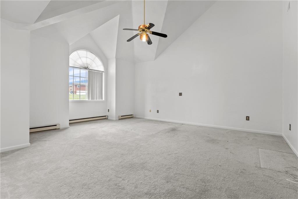 9260 Lakeview Drive Irwin, PA 15642 - Photo 23 of 47 an empty room with windows and fan