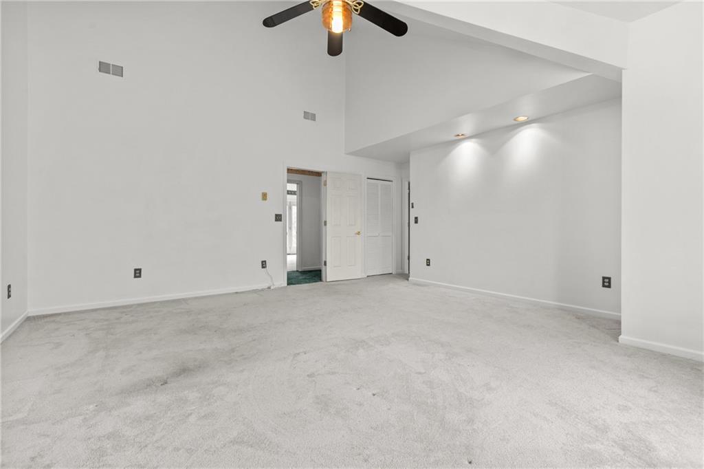 9260 Lakeview Drive Irwin, PA 15642 - Photo 25 of 47 an empty room with ceiling fan and window