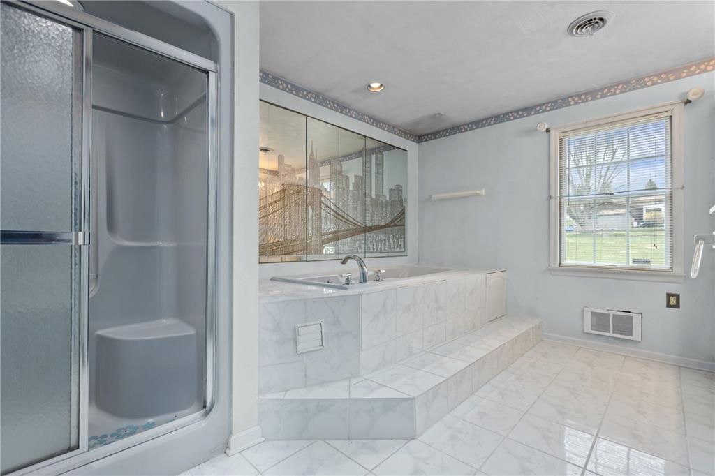 9260 Lakeview Drive Irwin, PA 15642 - Photo 26 of 47 a bathroom with a bathtub and a shower