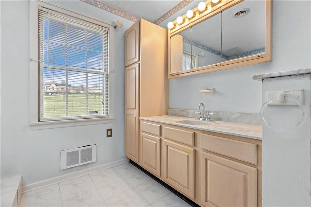 9260 Lakeview Drive Irwin, PA 15642 - Photo 27 of 47 a bathroom with a sink and a mirror