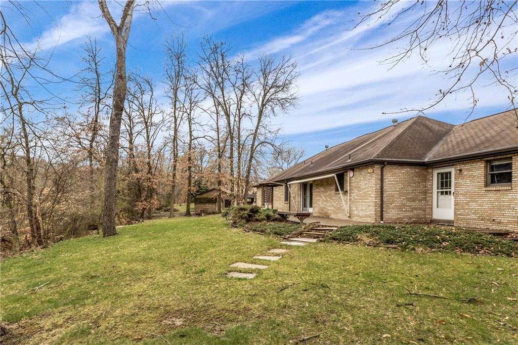 9260 Lakeview Drive Irwin, PA 15642 - Photo 38 of 47 a white house that has a tree in front of it