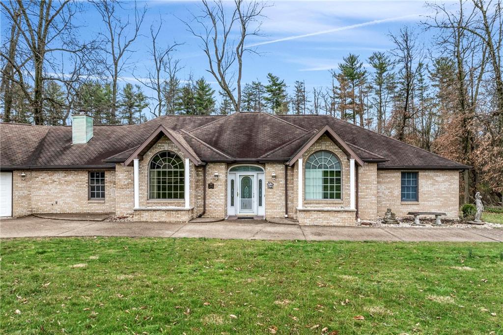 9260 Lakeview Drive Irwin, PA 15642 - Photo 40 of 47 a front view of a house with garden