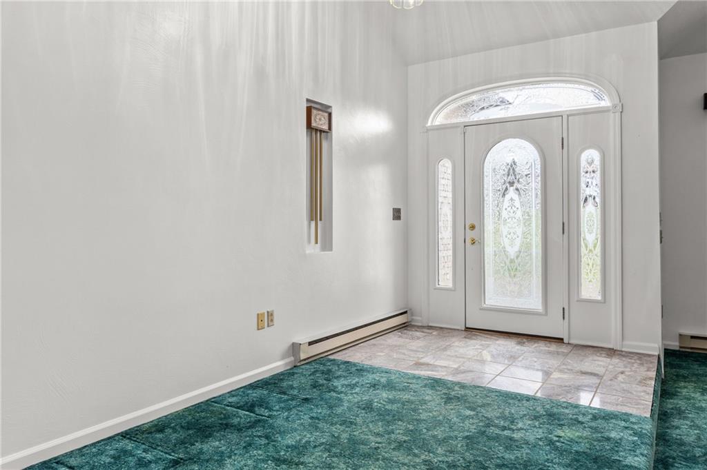 9260 Lakeview Drive Irwin, PA 15642 - Photo 4 of 47 an empty room with windows and entrance