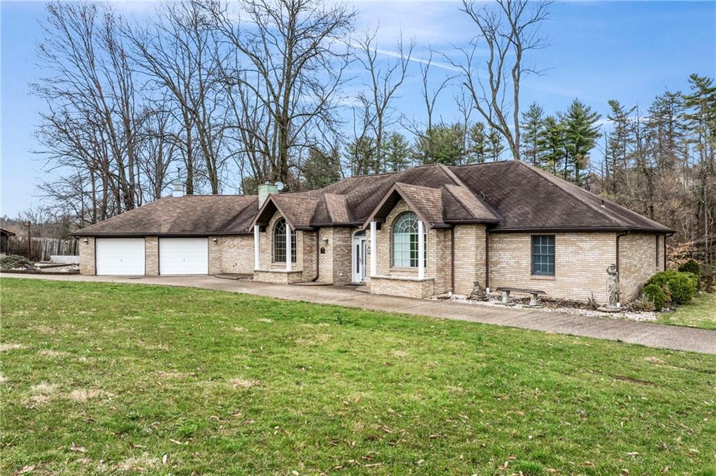 9260 Lakeview Drive Irwin, PA 15642 - Photo 41 of 47 a front view of a house with garden