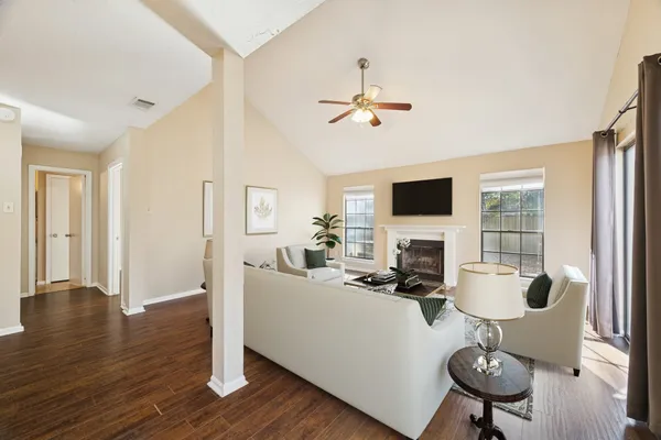 a living room with furniture or chandelier and a flat screen tv