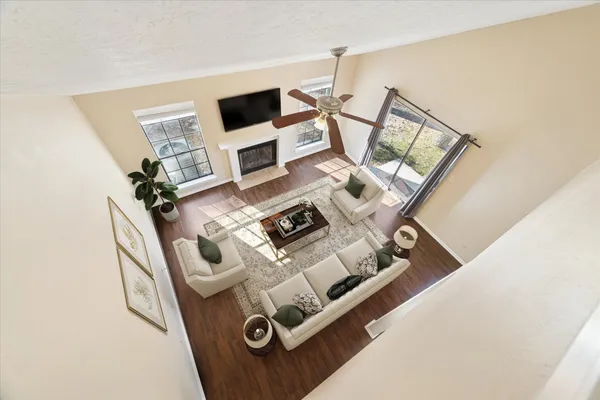 view of living room with furniture and floor to ceiling window