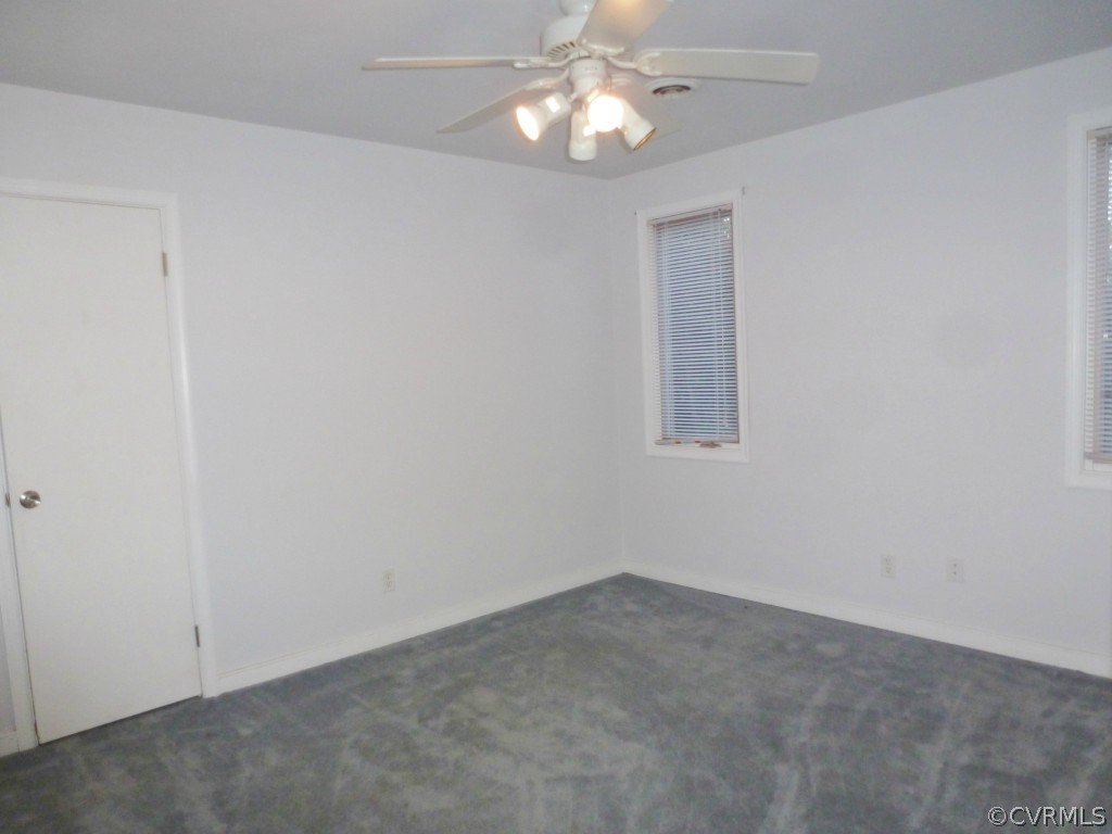 10424 Melissa Mill Road Chesterfield, VA 23236 - Photo 11 of 23 an empty room with a chandelier fan
