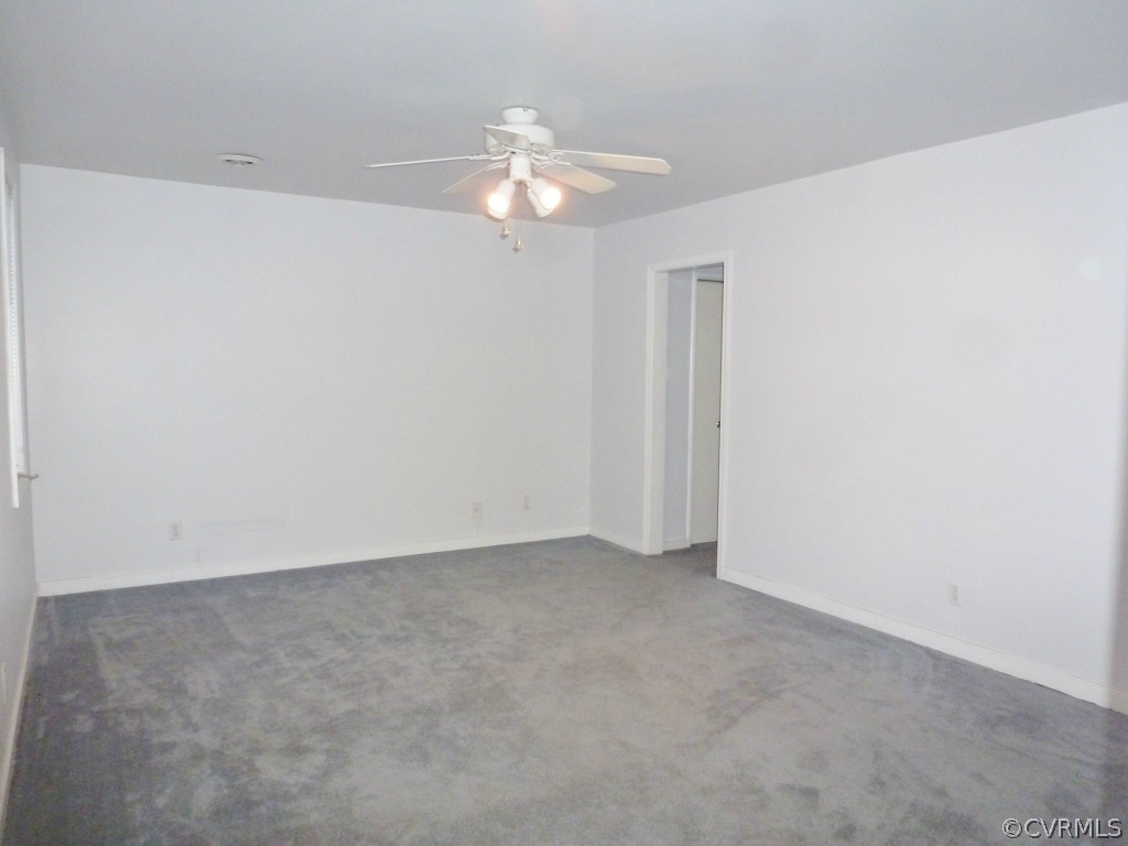 10424 Melissa Mill Road Chesterfield, VA 23236 - Photo 12 of 23 a view of an empty room with a chandelier fan