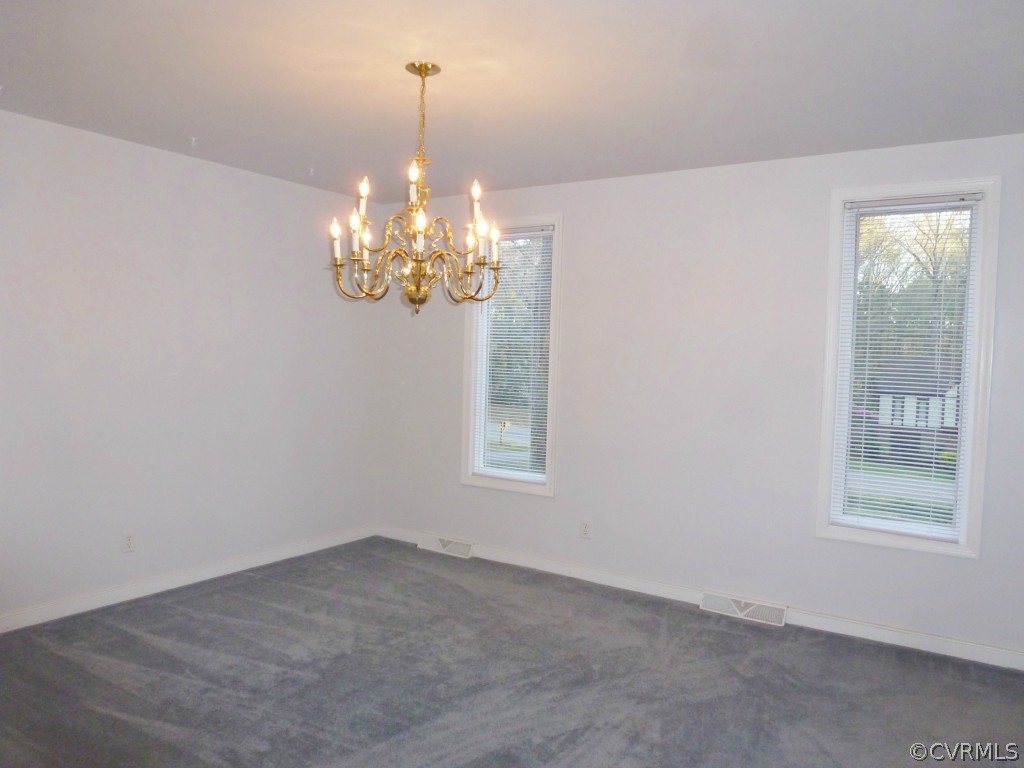 10424 Melissa Mill Road Chesterfield, VA 23236 - Photo 14 of 23 a view of a chandelier in a room