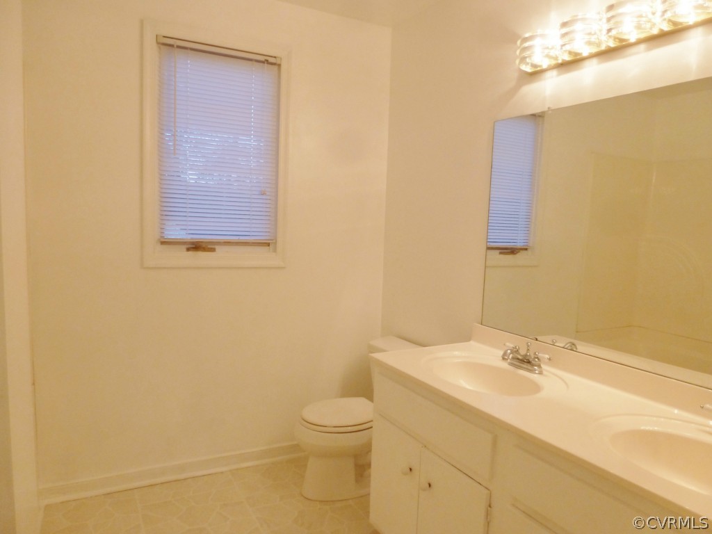 10424 Melissa Mill Road Chesterfield, VA 23236 - Photo 15 of 23 a bathroom with a granite countertop toilet and sink