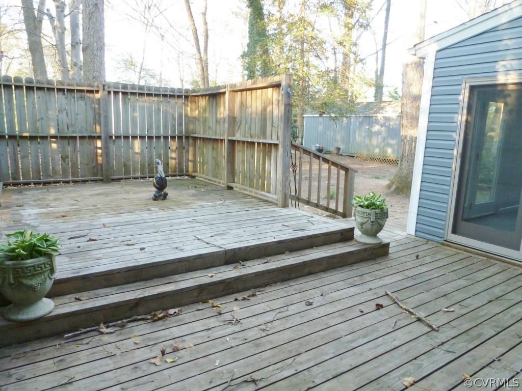 10424 Melissa Mill Road Chesterfield, VA 23236 - Photo 16 of 23 a view of a backyard with wooden floor